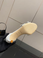 White leather sandal sole and heel, beige outsole view