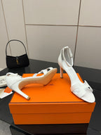 White heeled sandals with open toe, slim strap across vamp, block heel