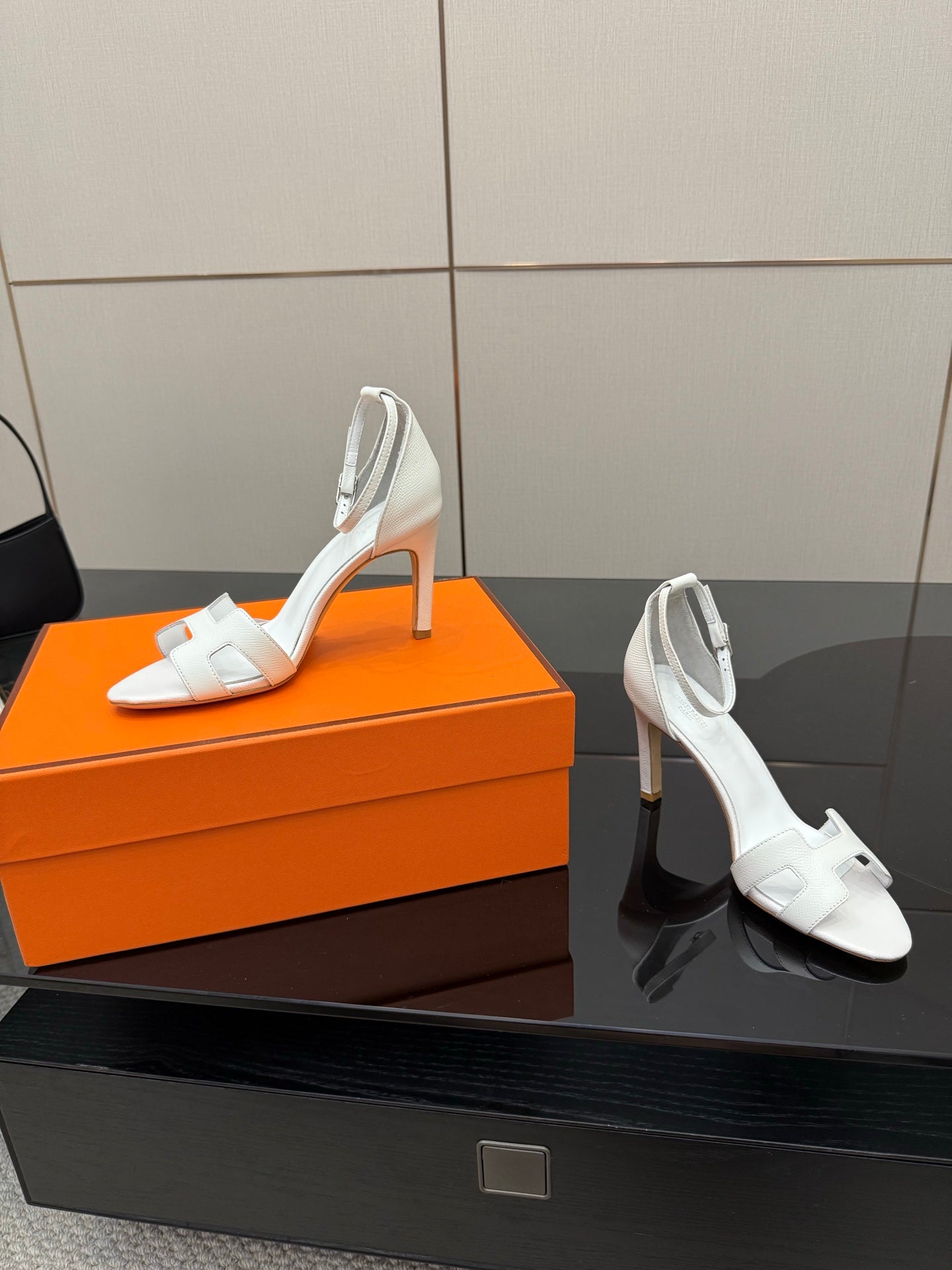 White heeled slingback sandals with open toe and thin ankle strap