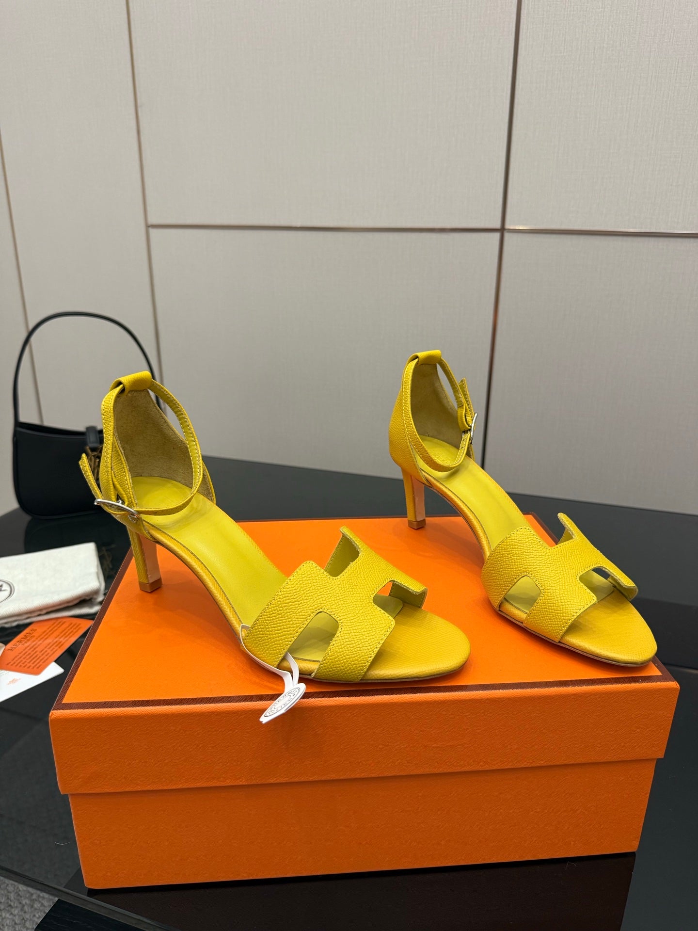 Yellow strappy heeled sandals with block heel and buckle ankle strap