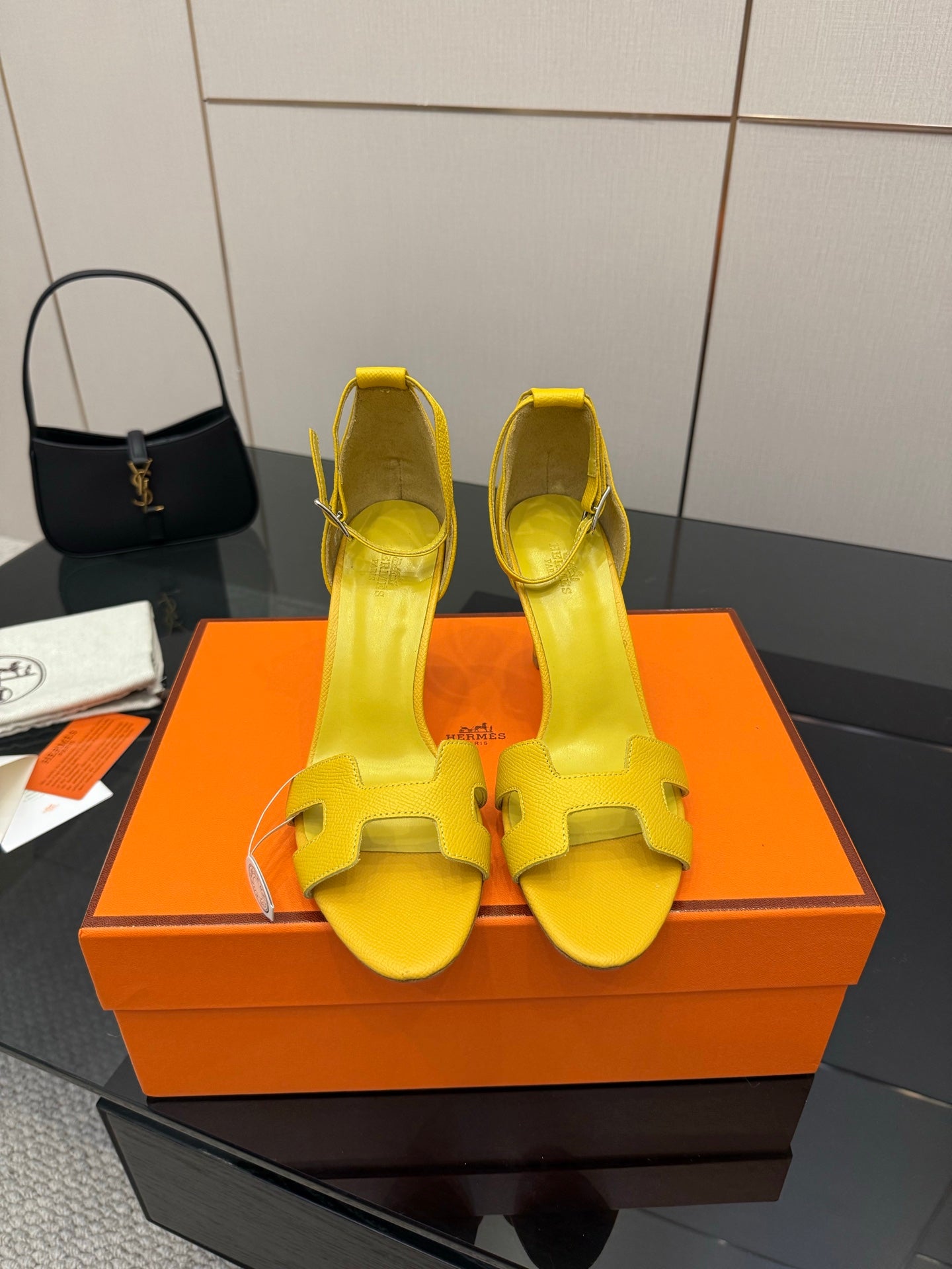 Hermes yellow heeled sandals with cutout straps, front view