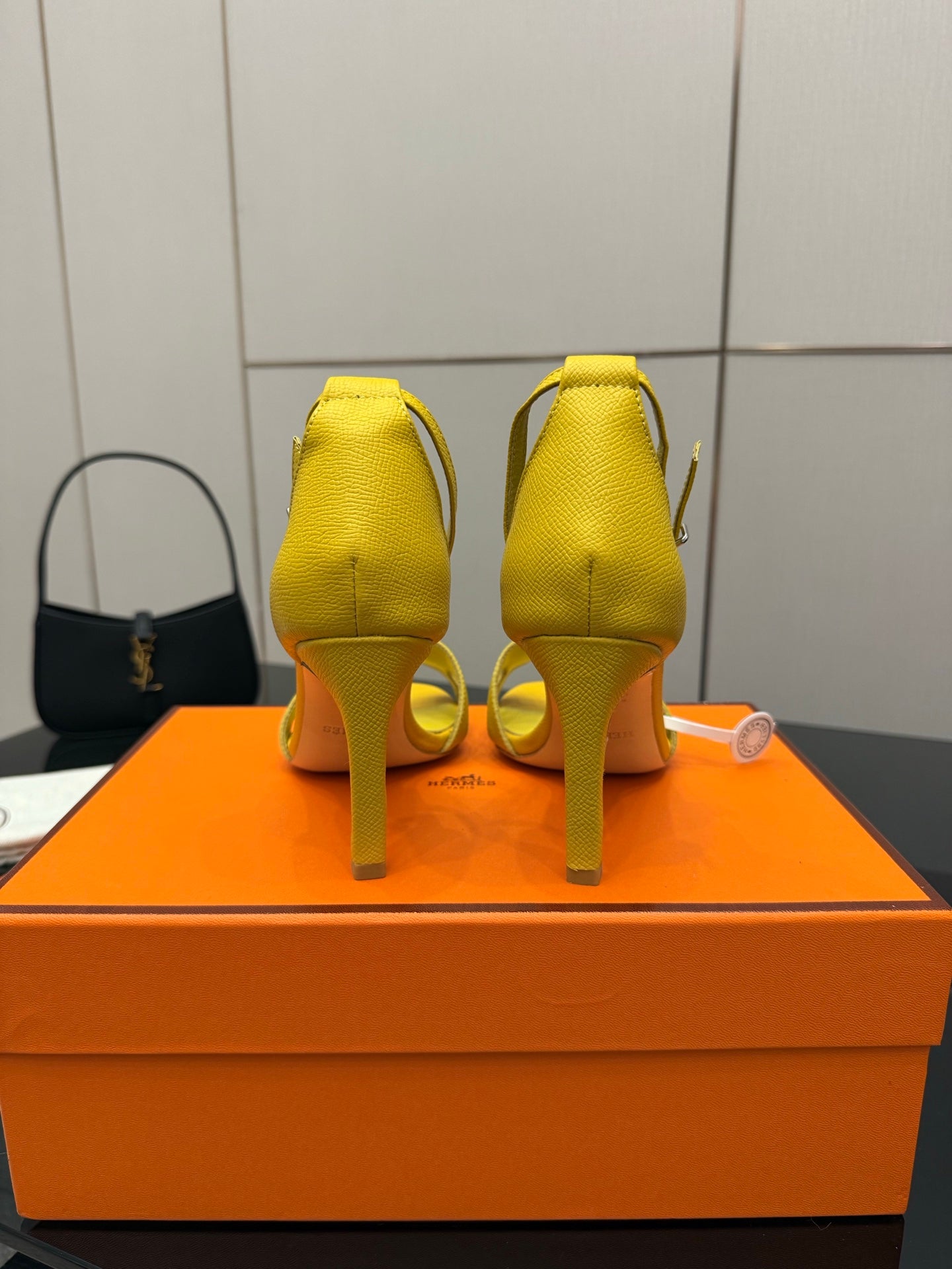 Hermes yellow heeled sandals, back view showing heel and ankle straps
