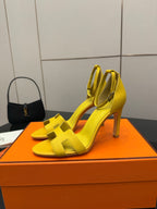 Hermes yellow heeled sandals with ankle strap, angled front view