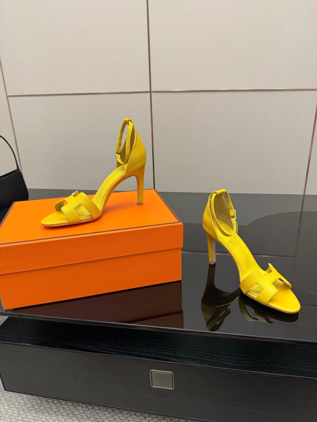 Hermes yellow heeled sandals, side view with thin stiletto heels