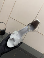 Ladies sandals, light gray leather upper with ankle strap, side view