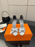Ladies' light-gray heeled sandals with ankle strap and open toe cutouts