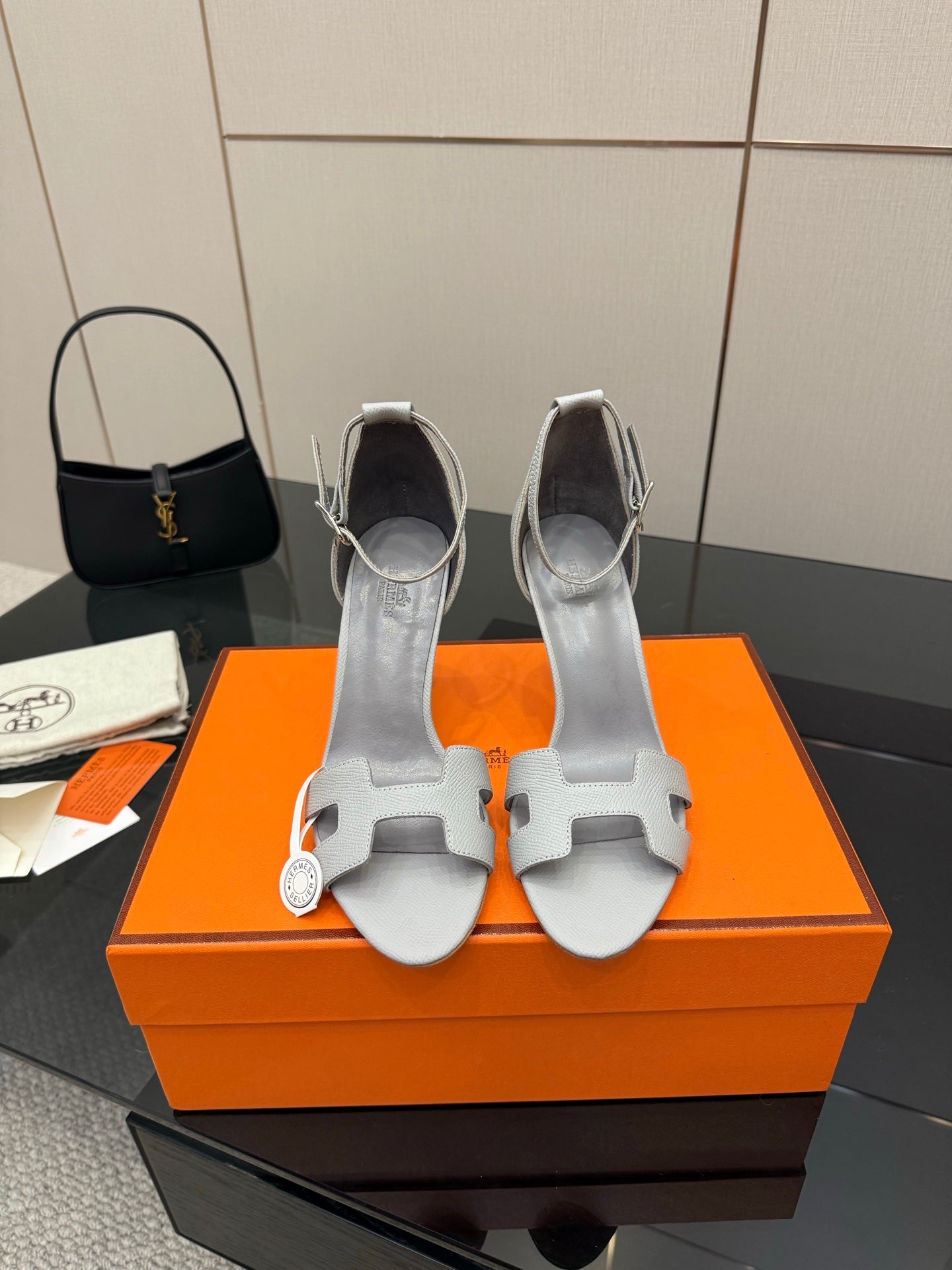 Ladies' light-gray heeled sandals with ankle strap and open toe cutouts