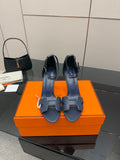 Hermes blue leather heeled sandals with ankle strap, buckle, and open toe cutouts