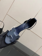 Ladies blue heeled sandal, side view with wide strap and open toe