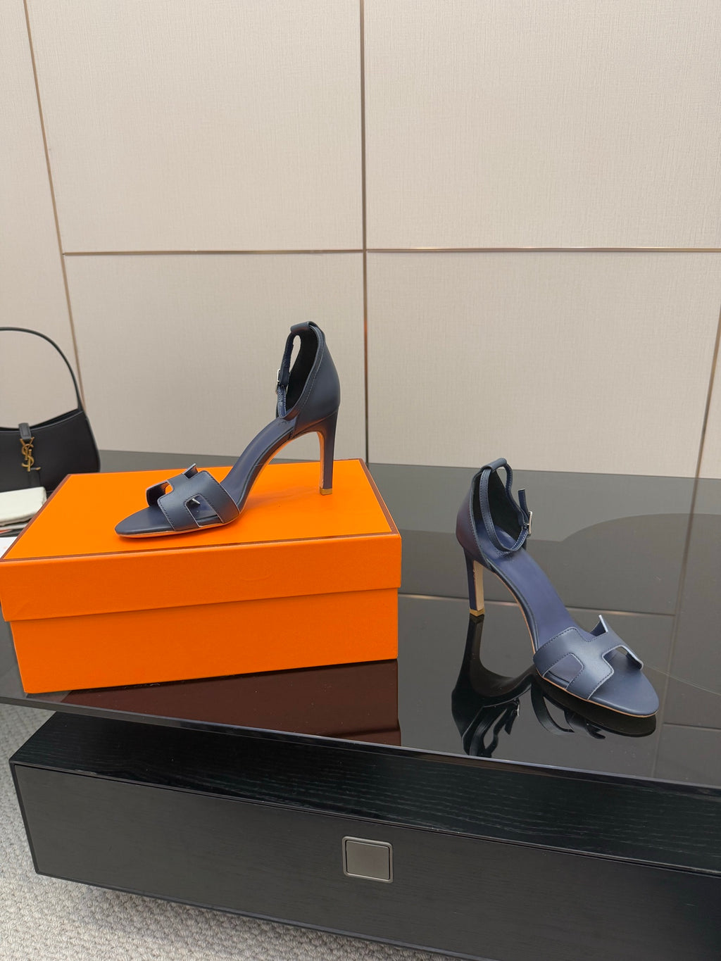 Hermes blue leather heeled sandal, side view with ankle buckle strap