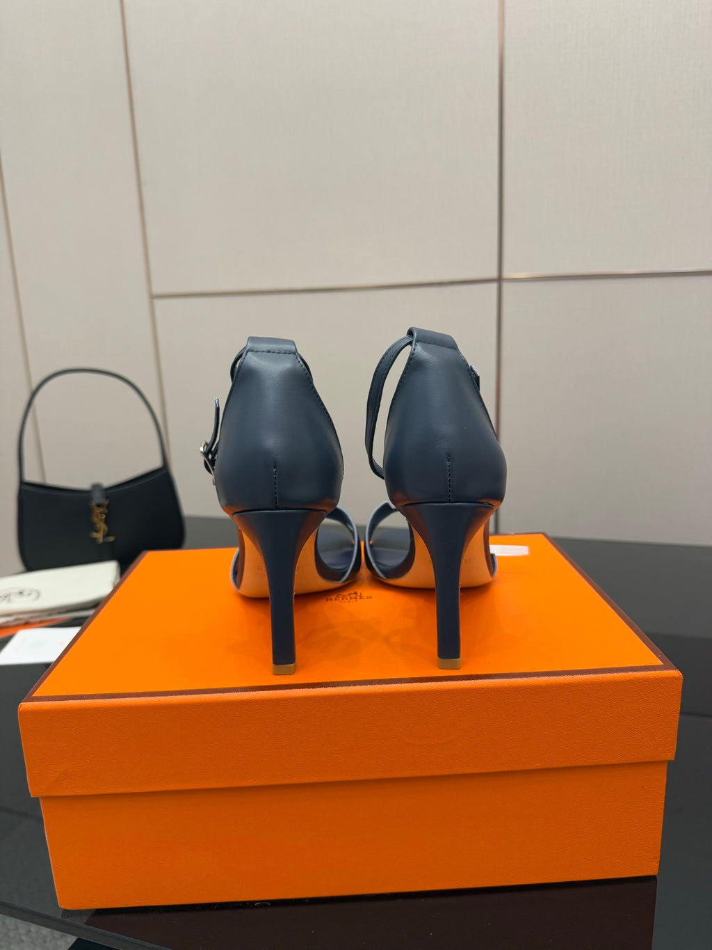 Hermes blue leather heeled sandals, back view with slim stiletto heels