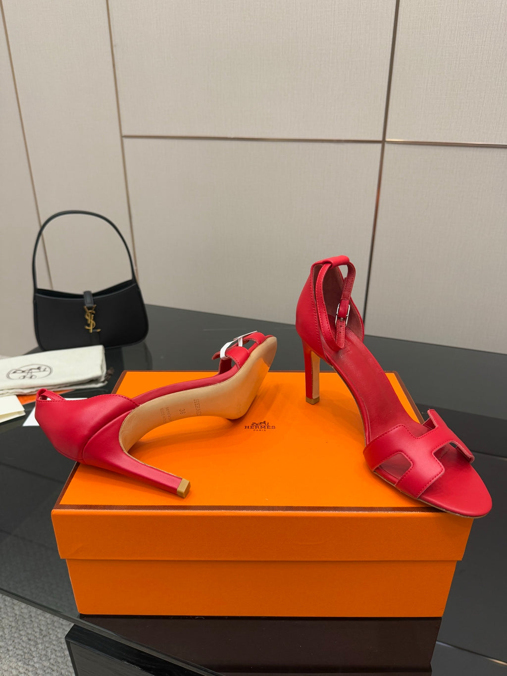 Hermes red heeled sandals with wide straps and open toe, profile view