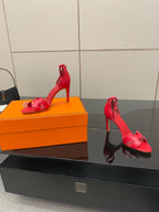Hermes red strappy sandals with stiletto heels, side view