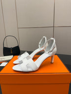 White heeled sandal with wide strap and open toe front
