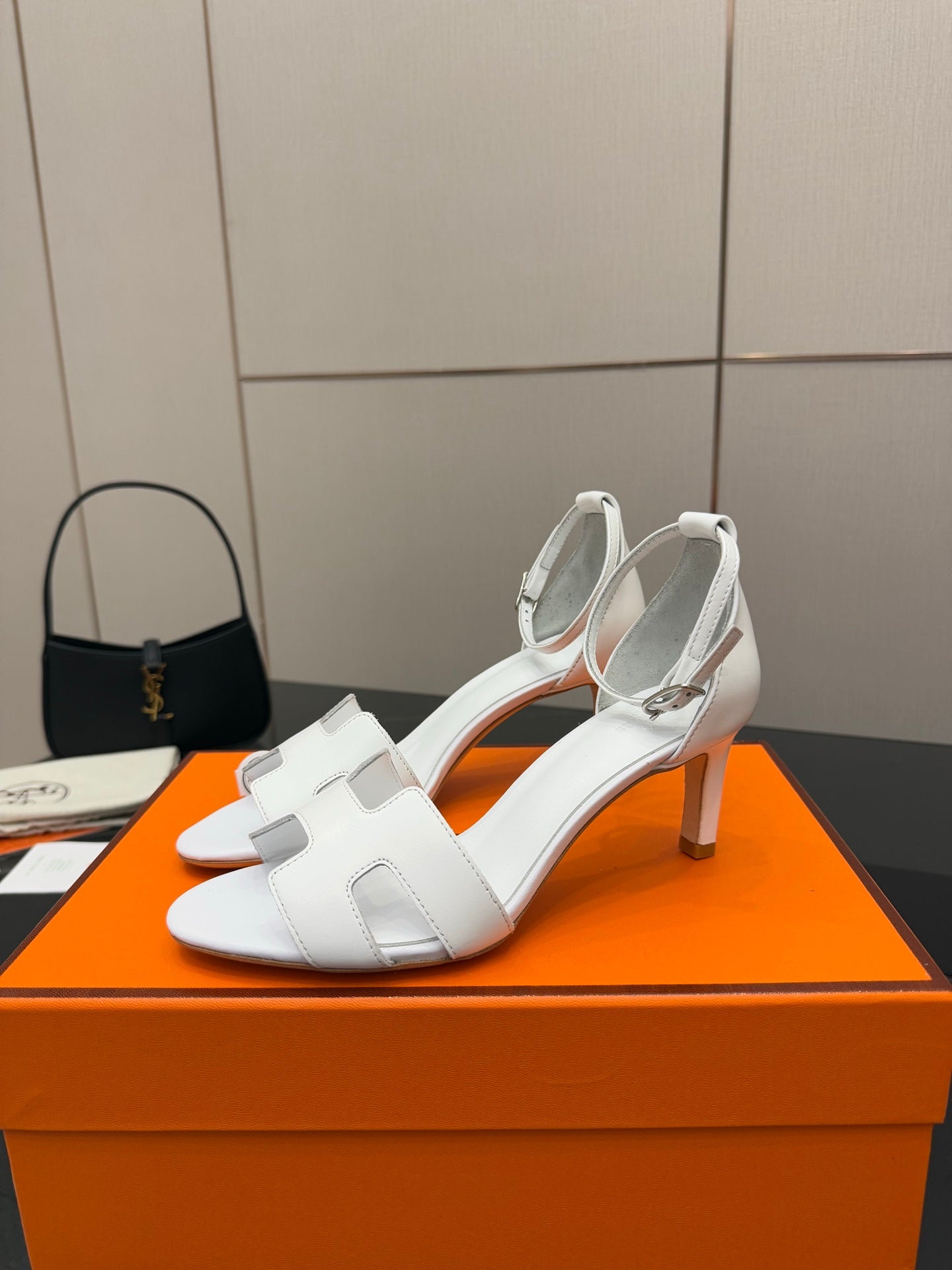White heeled sandal with wide strap and open toe front