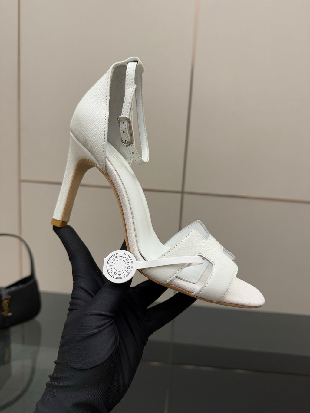 White heeled slingback sandal with textured leather upper and ankle strap