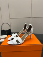 Hermes white leather heeled sandals with square cutout strap and slender heel