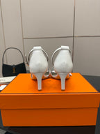 Hermes white leather heeled sandals, rear view with slingback strap and heel