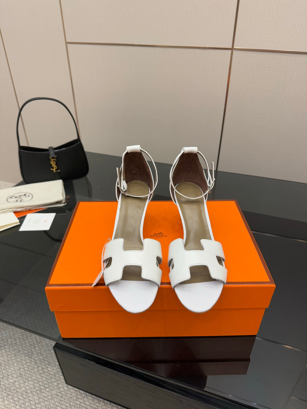Hermes white leather heeled sandals with cutout strap detail, open-toe design