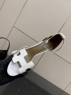Hermes white leather heeled slingback sandal with cutout strap and ankle strap