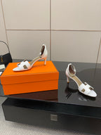 Hermes white leather heeled slingback sandals with open toe and adjustable strap