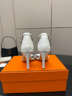 White heeled sandals back view with ankle strap and slim heel