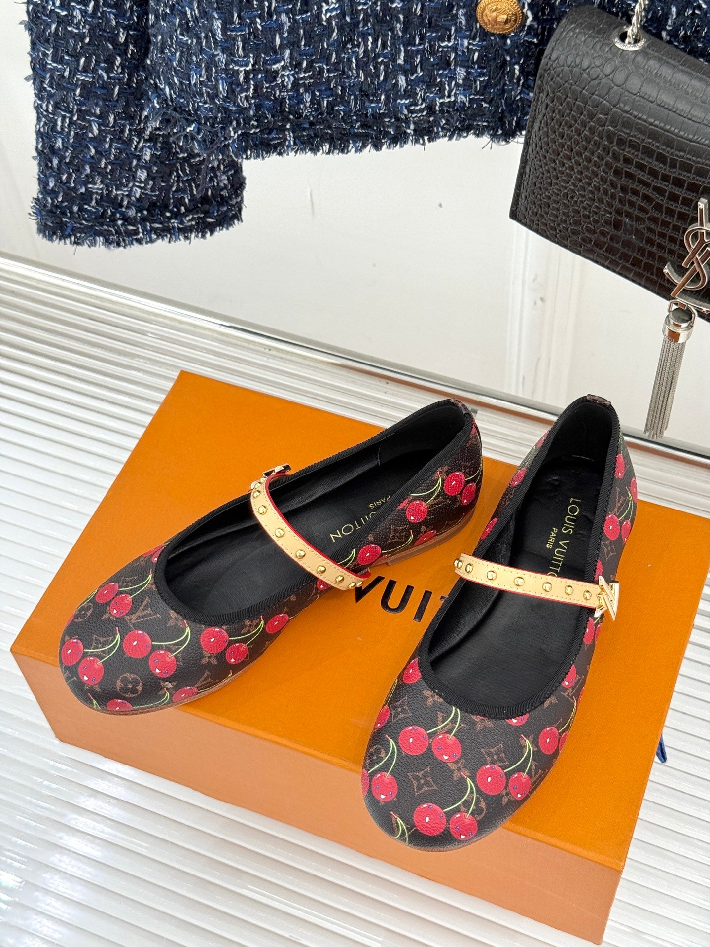 Women's cherry-print ballet flats with black lining and gold studded strap