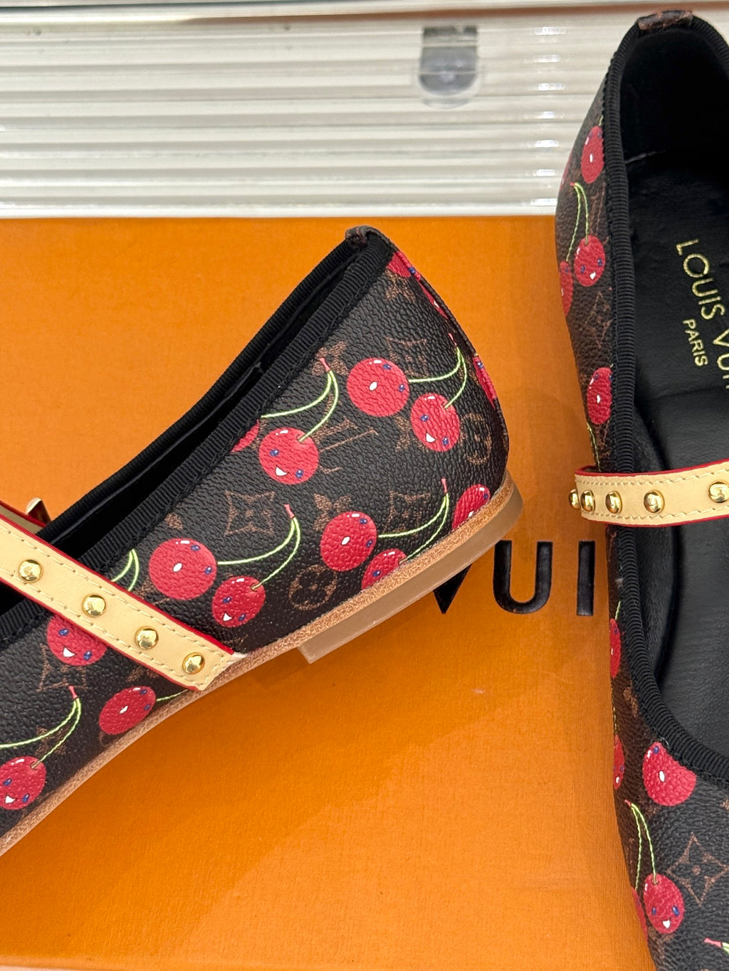 Women's cherry-print ballet flats with gold studded strap and black interior