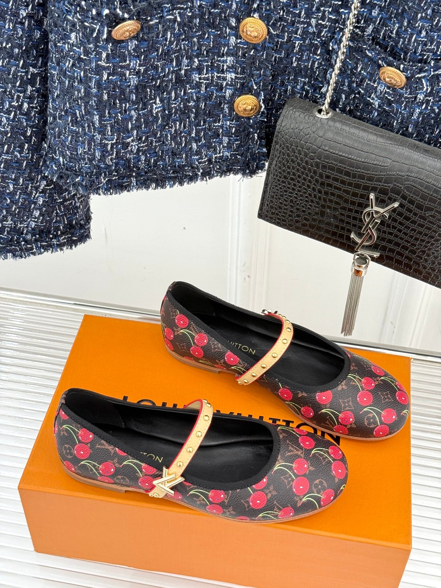Women's black cherry-print flats with gold studded strap and low profile