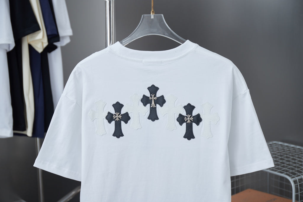 White short-sleeve T-shirt with dark cross graphic across upper back