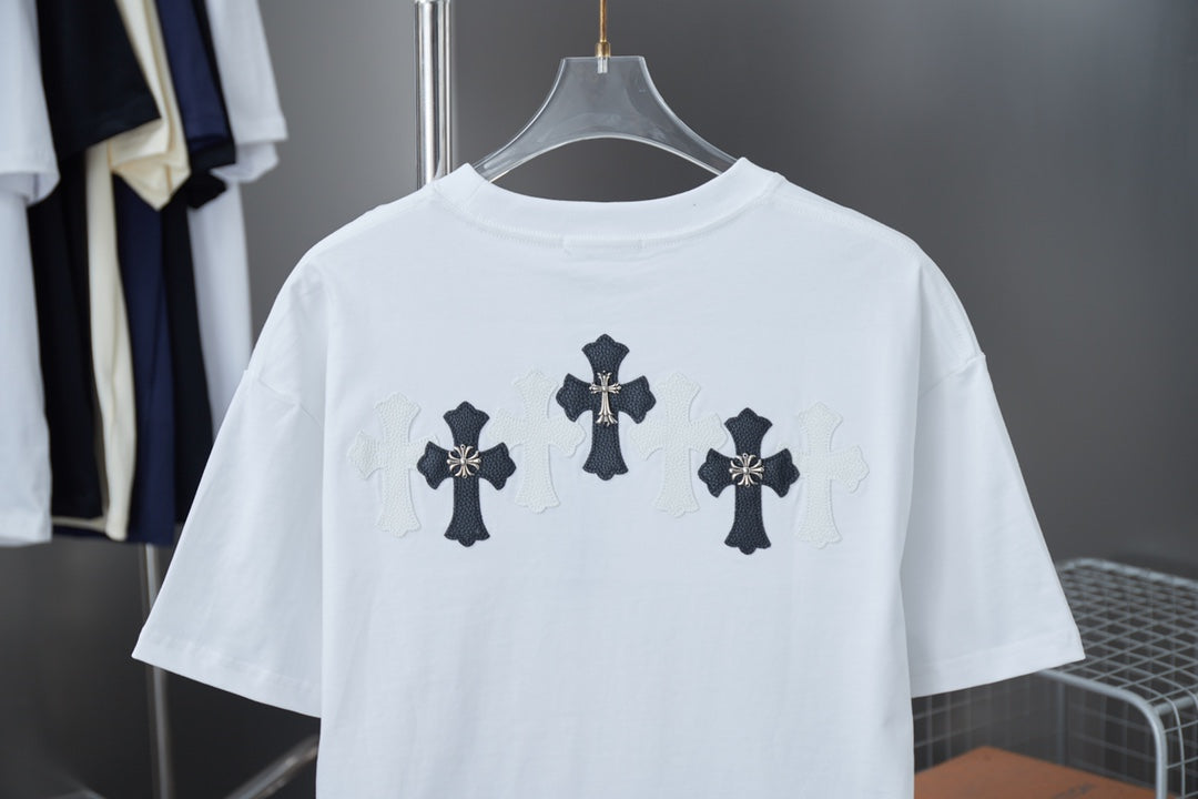 White short-sleeve T-shirt with dark cross graphic across upper back