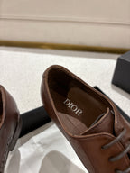 Brown leather lace-up dress shoe with Dior logo on inner lining