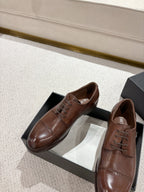 Brown leather lace-up dress shoes in black box, pointed toe