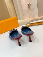 Two blue monogram mules on stiletto heels with burgundy patent trim