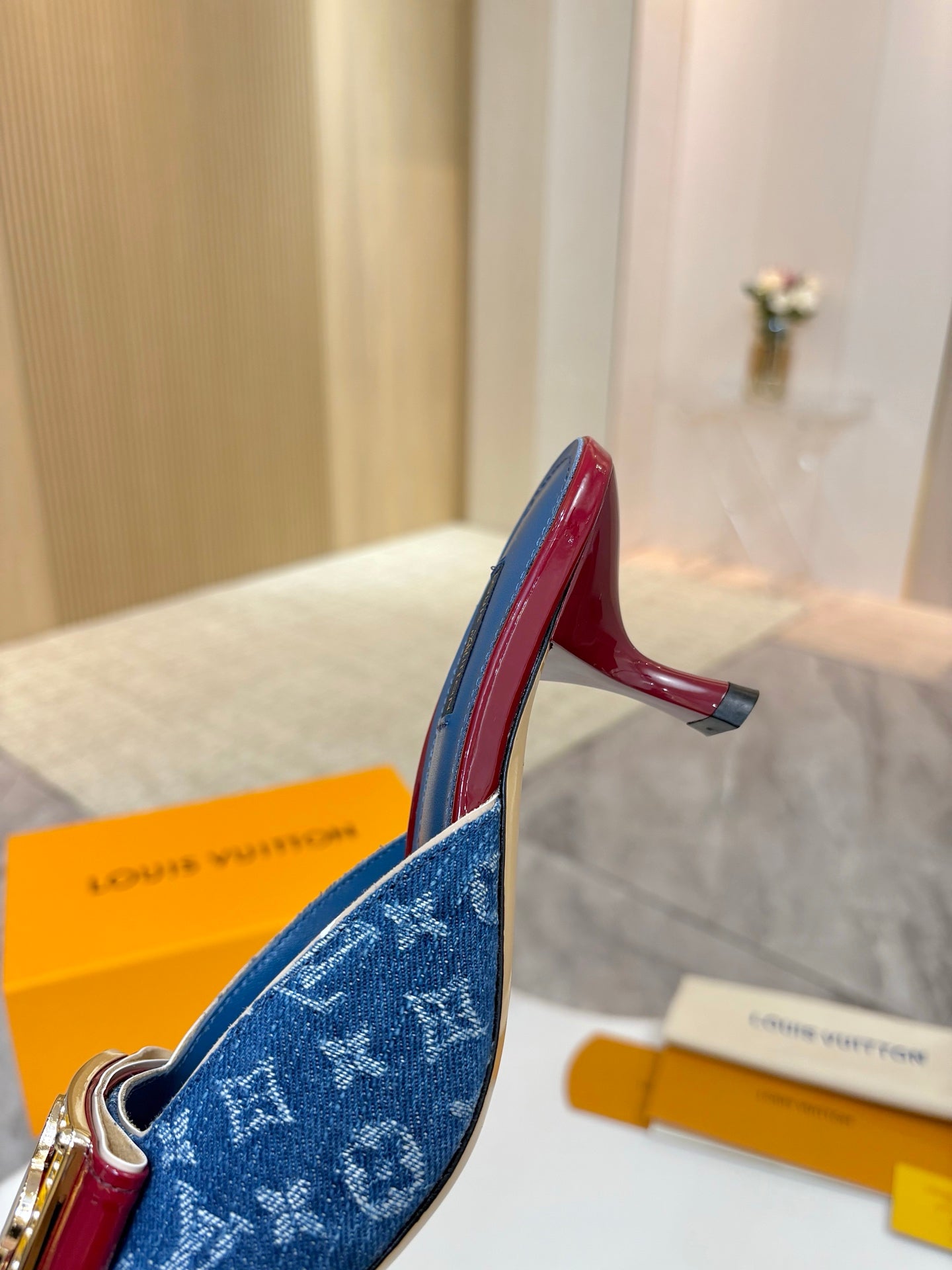Blue monogram heeled mule with burgundy interior lining and sculpted heel