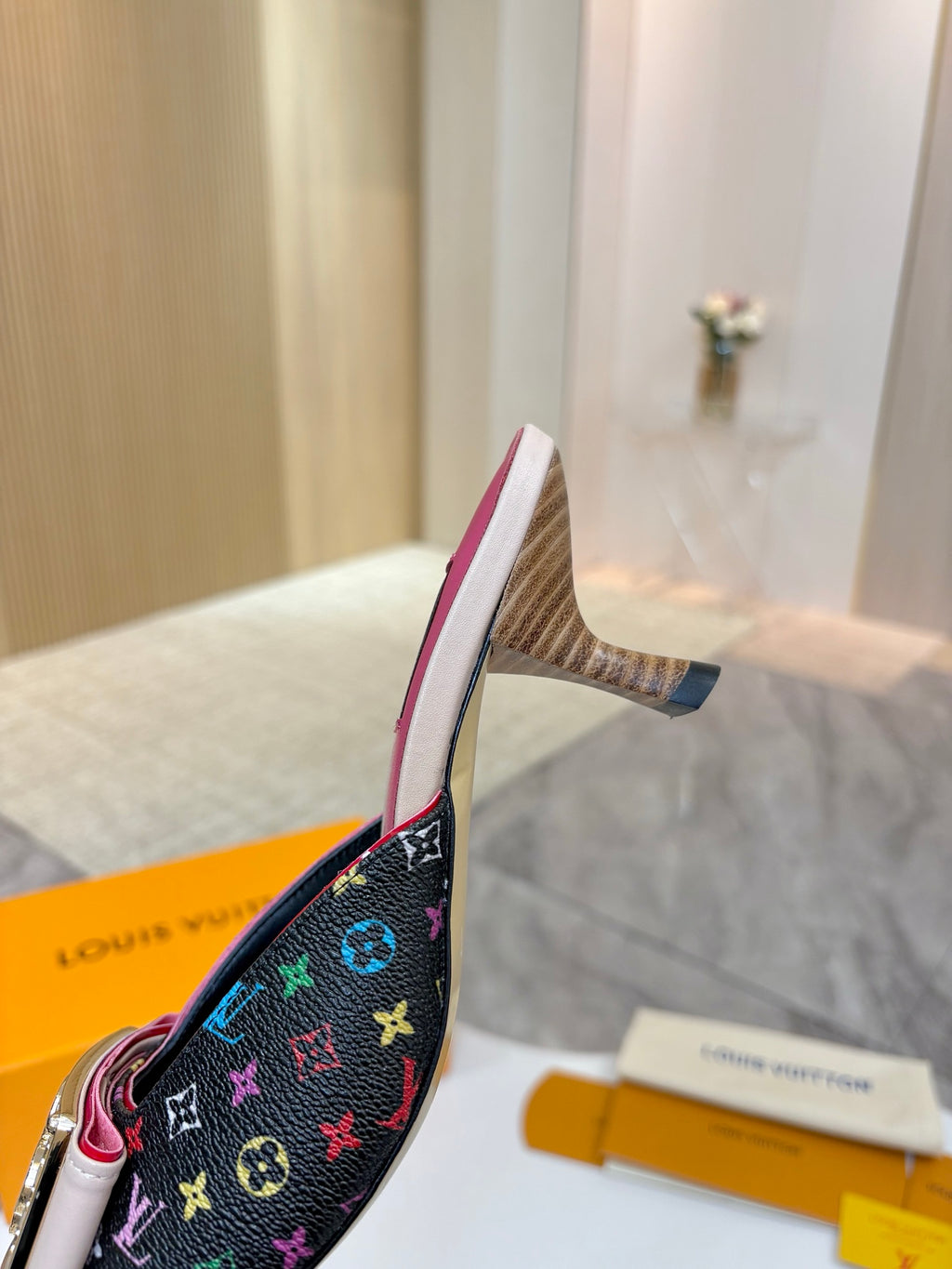Louis Vuitton ladies shoes heeled mule with dark multicolor monogram, pink sole, side profile