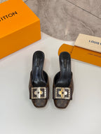 Louis Vuitton women's mule shoes, pair view with gold buckles and monogram uppers