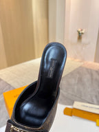 Louis Vuitton women's mule shoe, black leather upper with monogram vamp and gold buckle