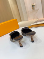 Louis Vuitton women's mule heels, pair backs with slender wooden heels and monogram straps
