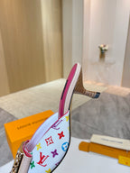 Louis Vuitton ladies mule side view, multicolor monogram upper, pink lining, sculpted low heel