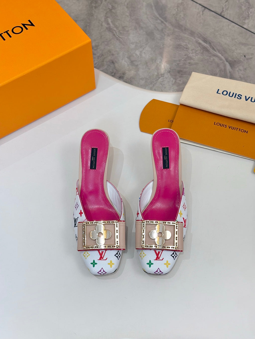 Louis Vuitton ladies mules with multicolor monogram, gold hardware, pink lining, low heels