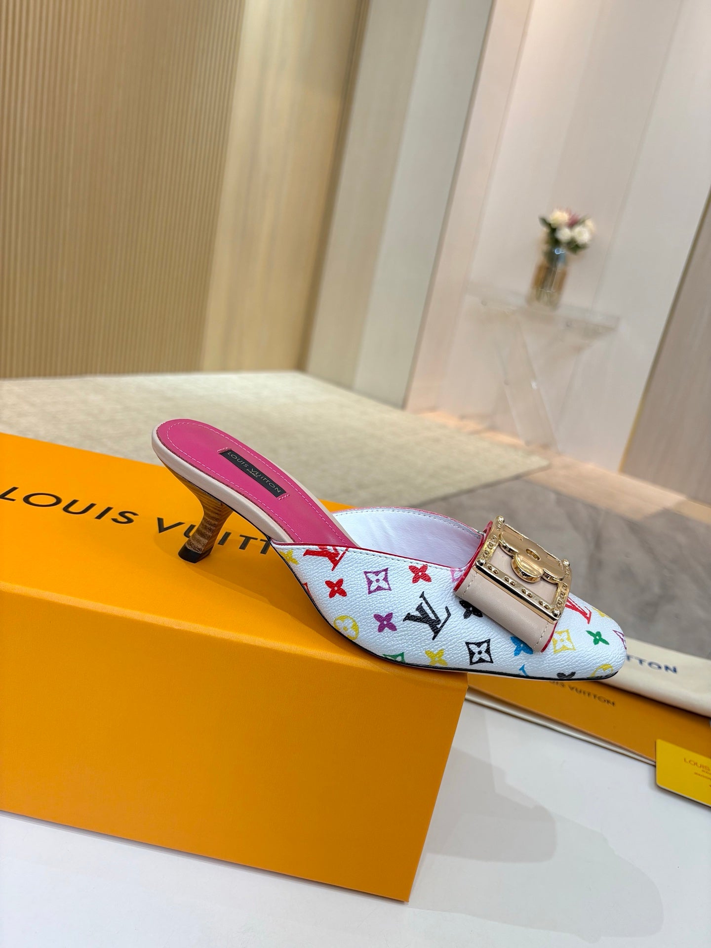 Louis Vuitton ladies mule with multicolor monogram print, gold buckle, pink interior
