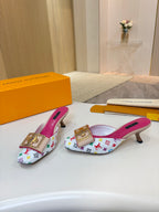 Louis Vuitton ladies mules, multicolor monogram print, gold buckle ornament, pink footbeds, low heels