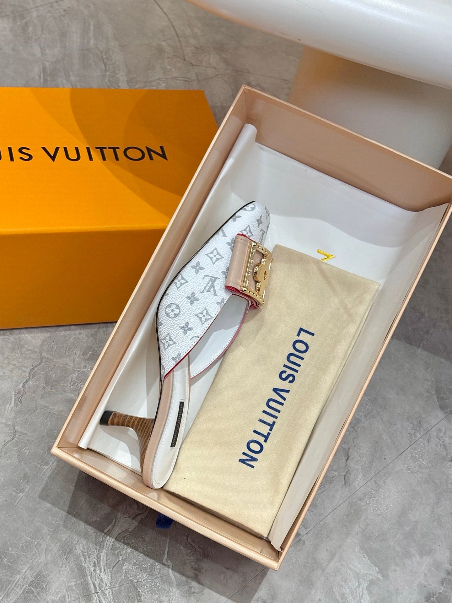 Louis Vuitton monogram mule in box with gold buckle and light blue straps