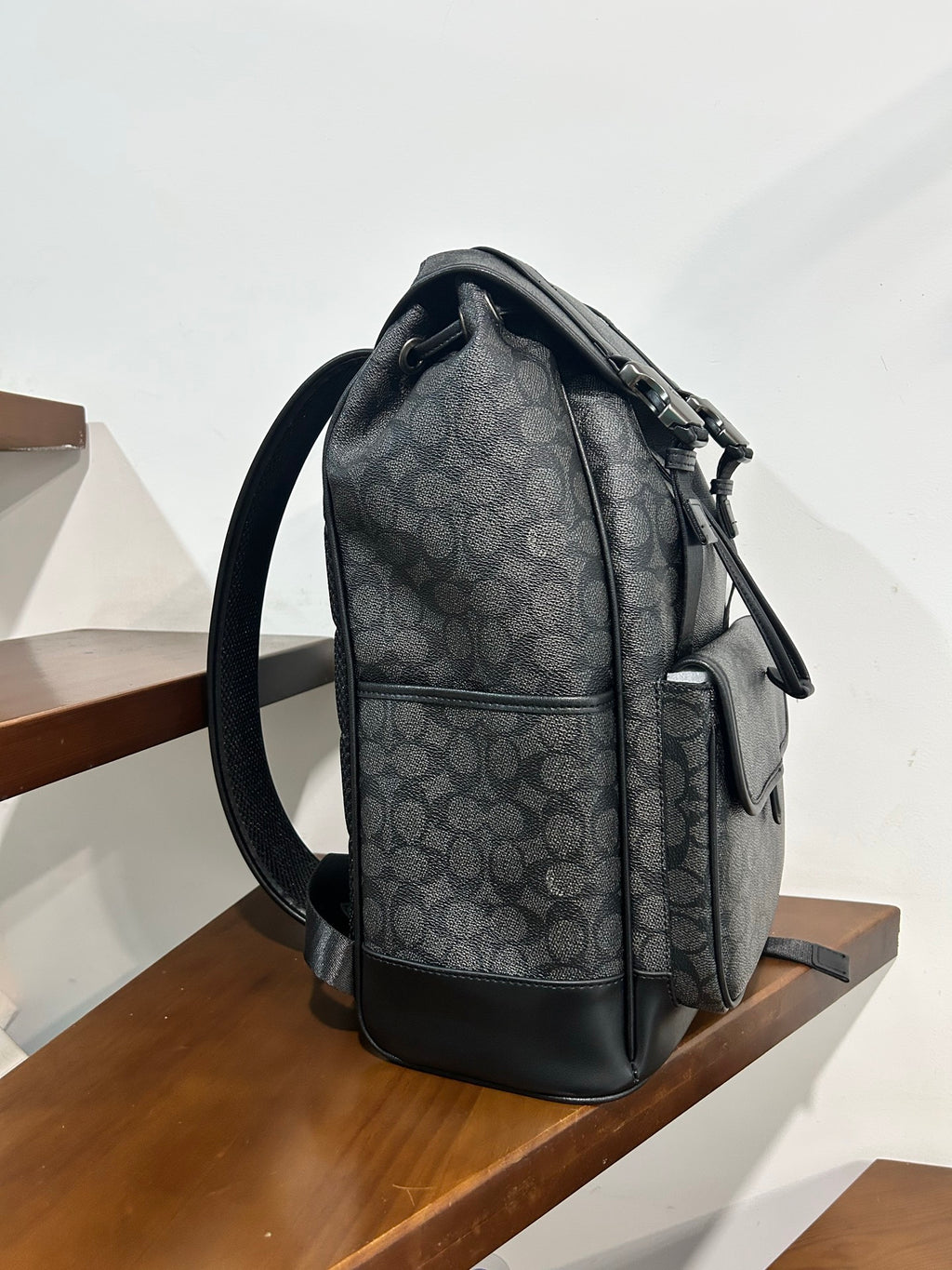 Charcoal monogram backpack with side zipper and adjustable shoulder strap