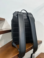 Charcoal monogram backpack back view with adjustable shoulder straps