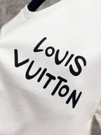 Louis Vuitton white T-shirt, close-up of Louis Vuitton logo print