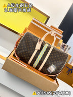 Louis Vuitton monogram duffel bag with striped center panel and light leather trim