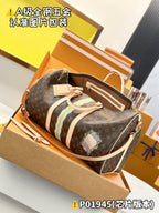 Monogram duffel bag with striped center panel, top handles, and front zip detail