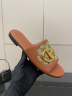 Gucci ladies slide sandals, GG canvas strap with gold buckle, tan slide sole